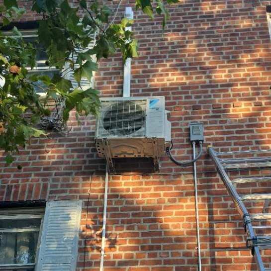 Heat pump outdoor condenser installed by Aura HVAC