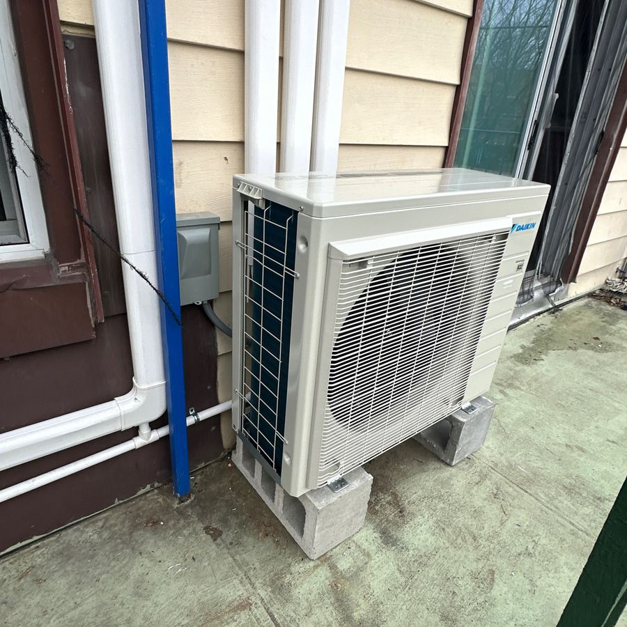 Heat pump outdoor condenser installed by Aura HVAC